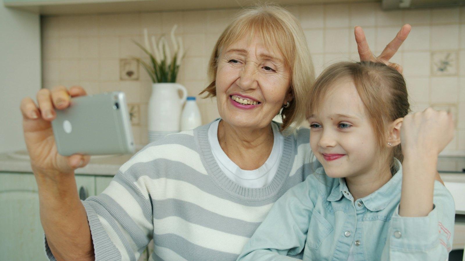 Grandmother and granddaughter taking a selfie
