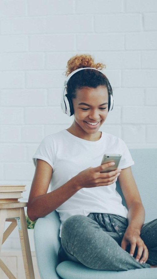 Woman smiling at a conversation on her phone