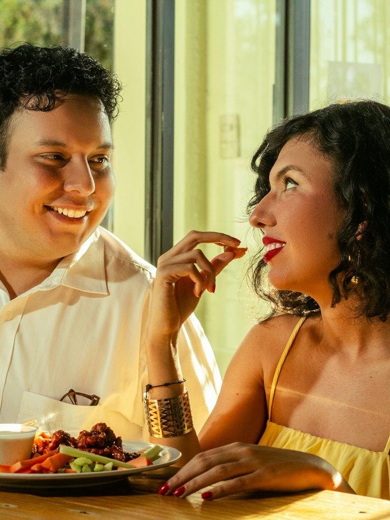 Couple laughing over dinner