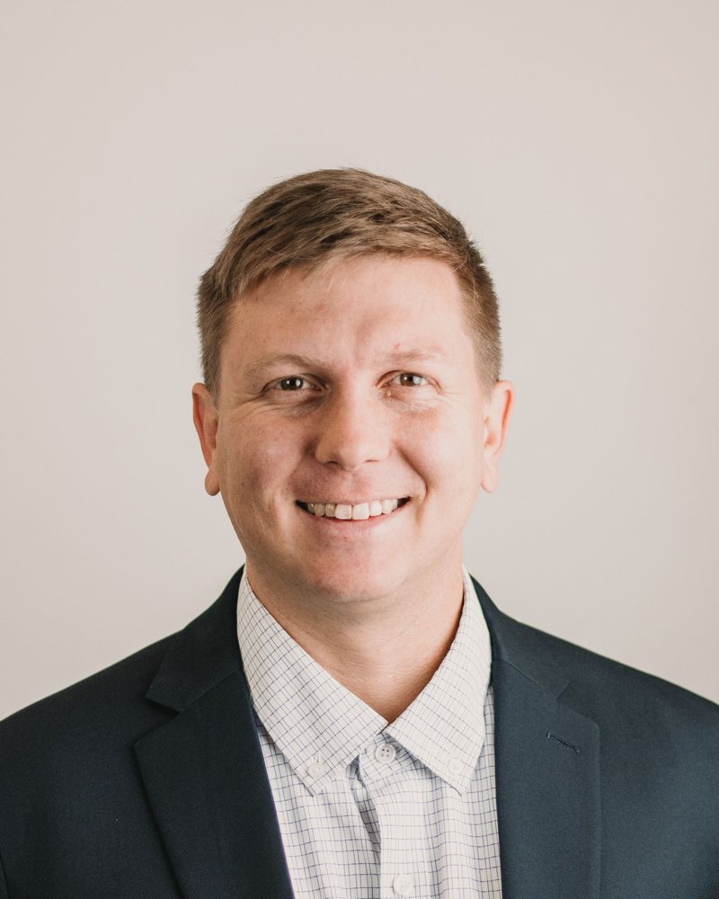 Sales leader smiling at the camera